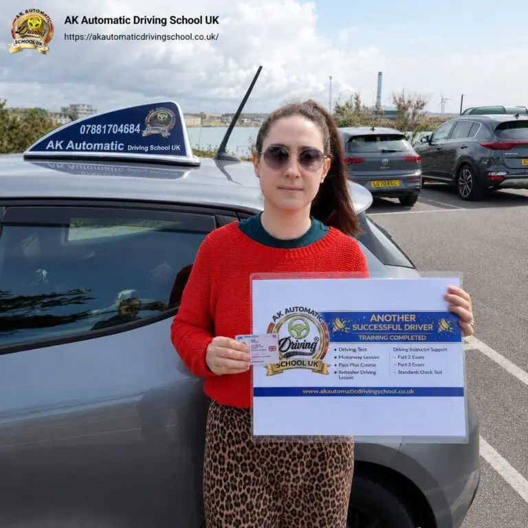 AK Automatic Driving School pupil holding a driving licence and training sign